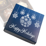 Navy blue gift box with white holiday designs and 'Happy Holidays' text.