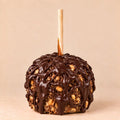 A Snickers Caramel Apple covered with dark chocolate. Made by Morkes Chocolates.